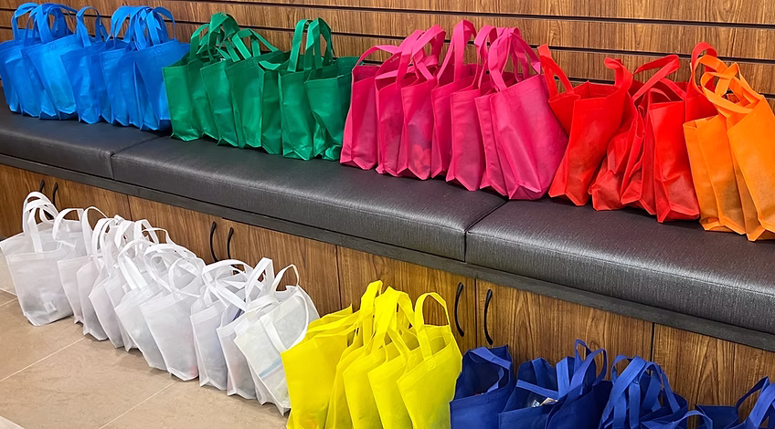 Care bags arranged on shelves